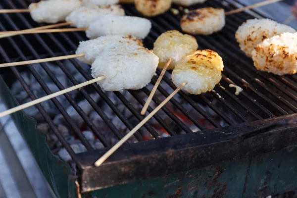 Grilling glutinous rice on brazier — Stock Photo, Image