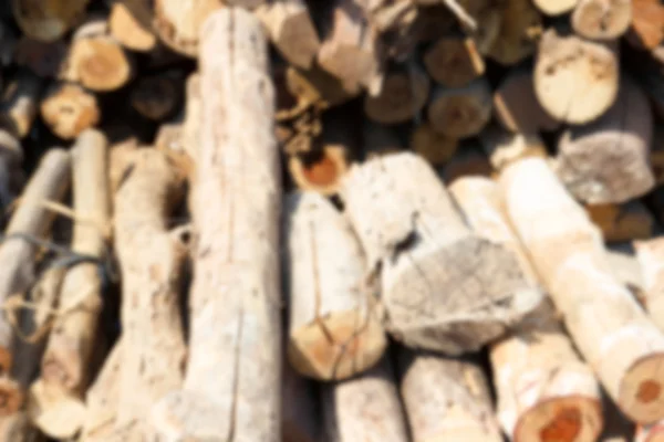 Blurry defocused image of firewood for background — Stock Photo, Image