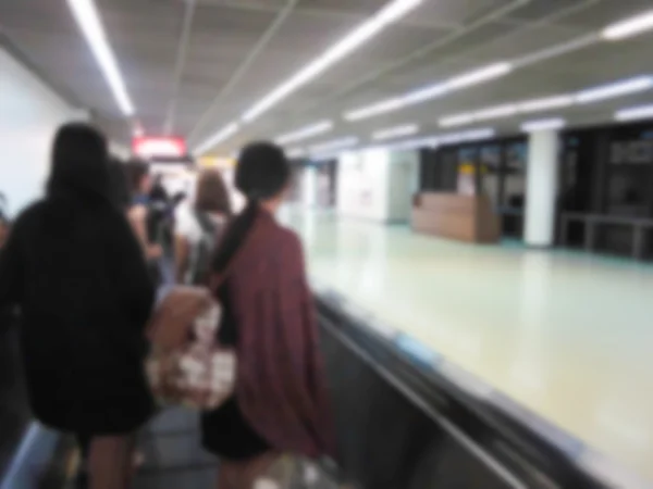 Blurry defocused people in airport — Stock Photo, Image