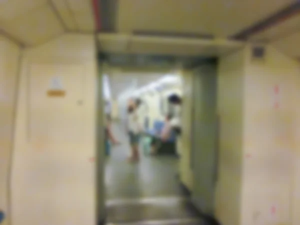 Blurry defocused image of people on underground train — Stock Photo, Image