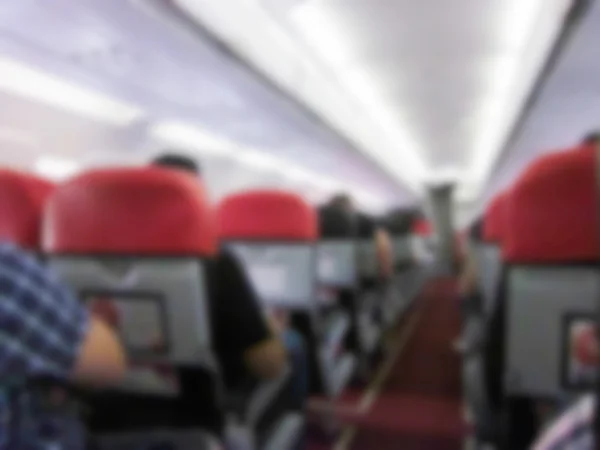 Blurry defocused image of passenger on airplane — Stock Photo, Image