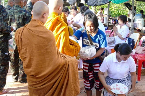 People put food offering to buddhist monk alms bowl which is the — Stock Photo, Image