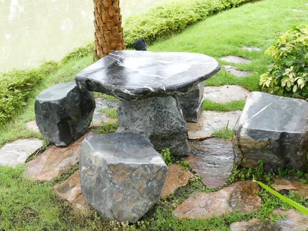 Stone chair and desk in the garden — Stock Photo, Image