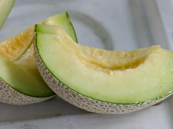 Kousky ovoce meloun řez — Stock fotografie