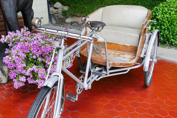 Old tricycle with beige leather cushion — Stock Photo, Image