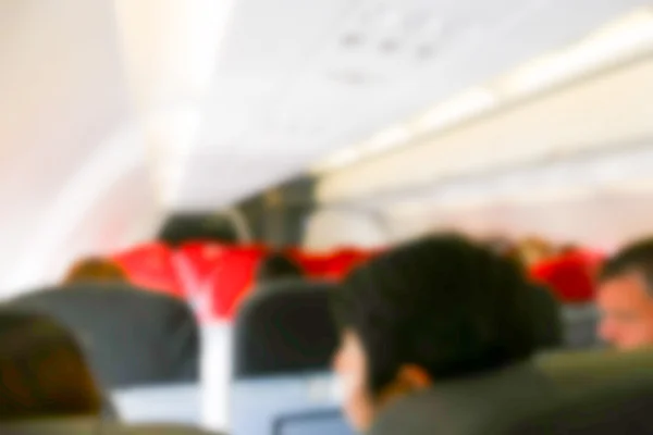 Suddig oskärpa bild av passagerare i flygplanet — Stockfoto