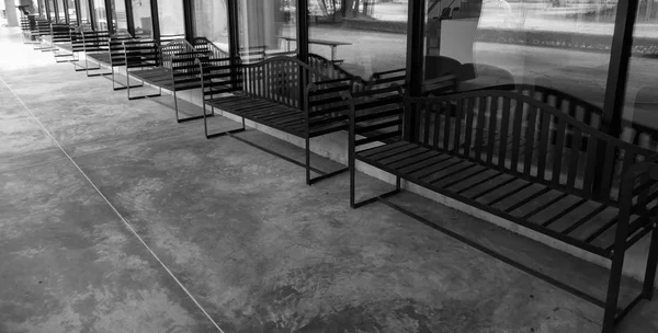 Row of black metal bench on the patio — Stock Photo, Image