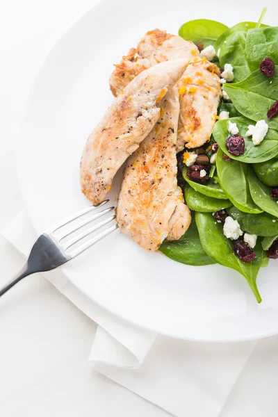Chicken with spinach salad — Stock Photo, Image