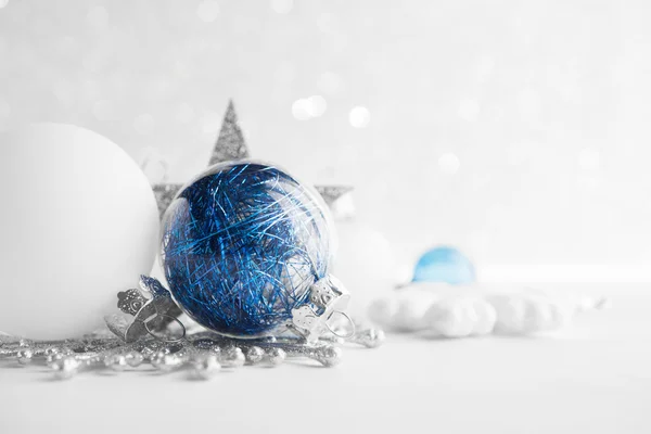 Blue and white xmas ornaments on glitter holiday background. Merry christmas card. Winter theme. Happy New Year. — Stock Photo, Image