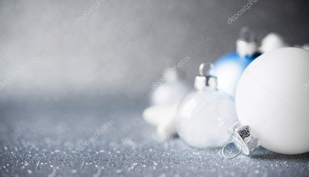Blue, silver and white xmas ornaments on glitter holiday background. Merry christmas card. Winter holidays. Xmas theme. Happy New Year.
