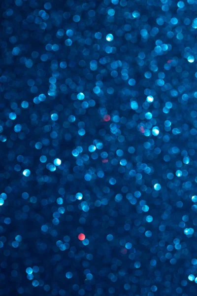 Unfocused abstract dark blue glitter bokeh holiday background. Winter xmas holidays. Christmas. — Stock Photo, Image