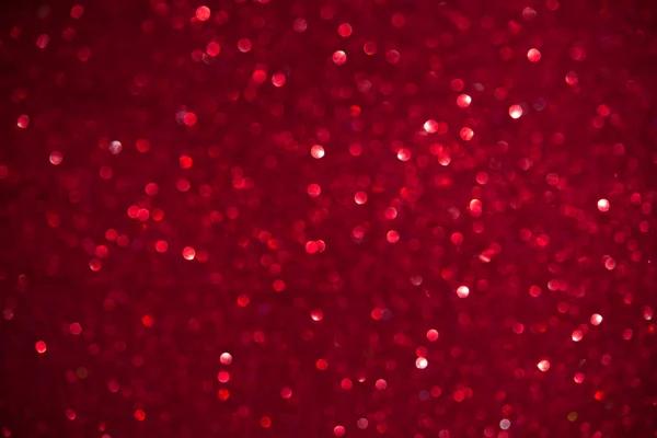 Unfocused abstract red glitter holiday background. Winter xmas holidays. Christmas. Valentine's day. — Stock Photo, Image