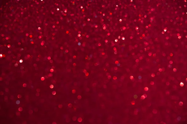 Unfocused abstract red glitter holiday background. Winter xmas holidays. Christmas. Valentine's day. — Stock Photo, Image