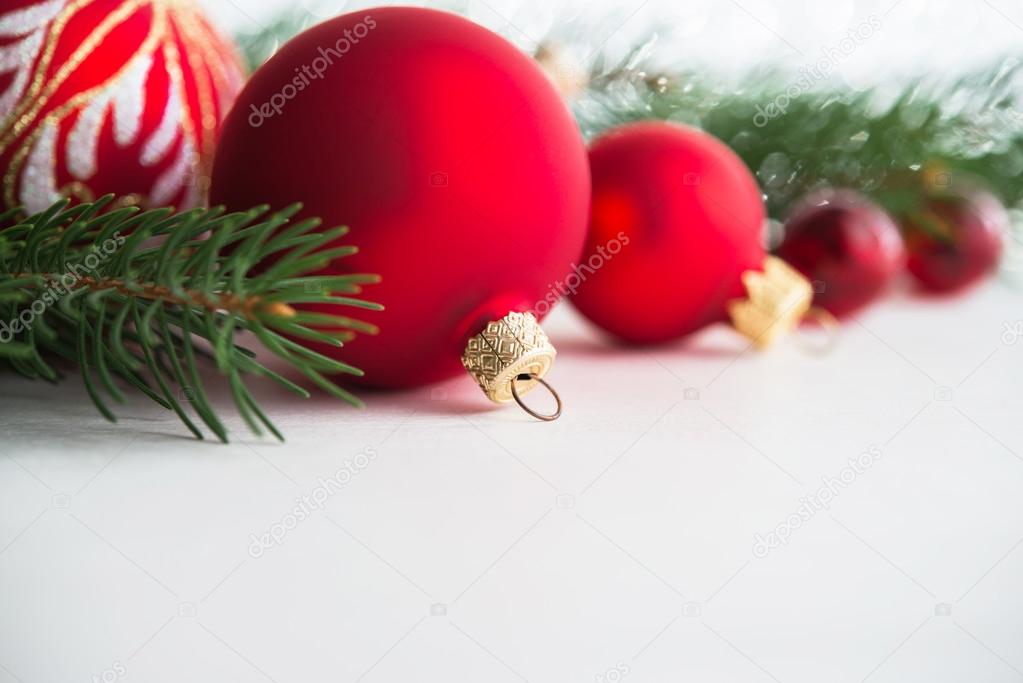 Red xmas ornaments on wooden background. Merry christmas card. Winter holiday theme. Happy New Year. 