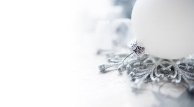 White and silver christmas decoration on holiday background. Merry christmas card.
