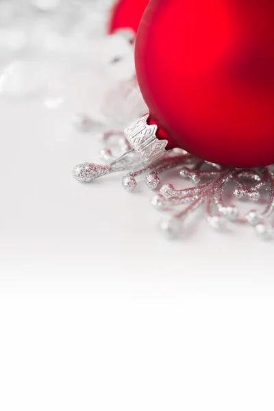 Red and silver xmas ornaments on bright holiday background. Merry christmas! — Stock Photo, Image