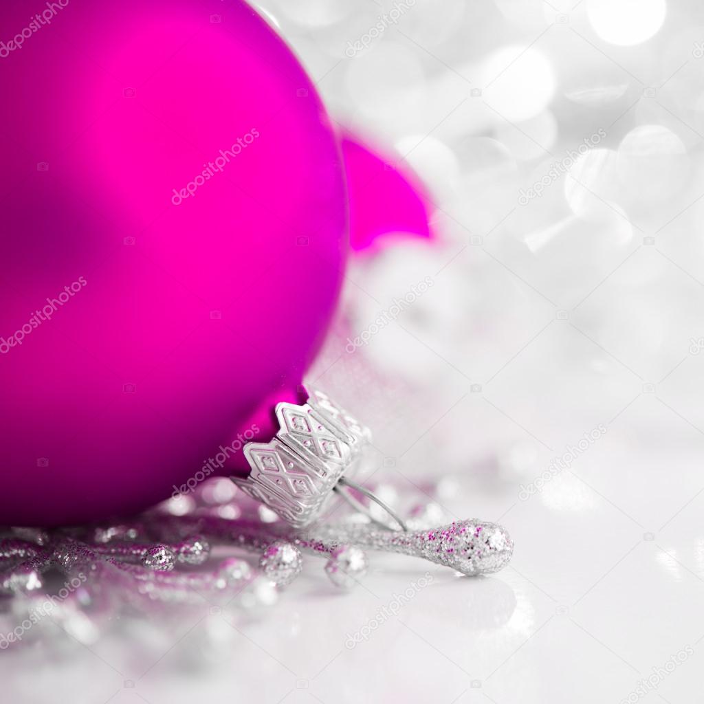 Silver and purple christmas ornaments on bright holiday background. Merry xmas!