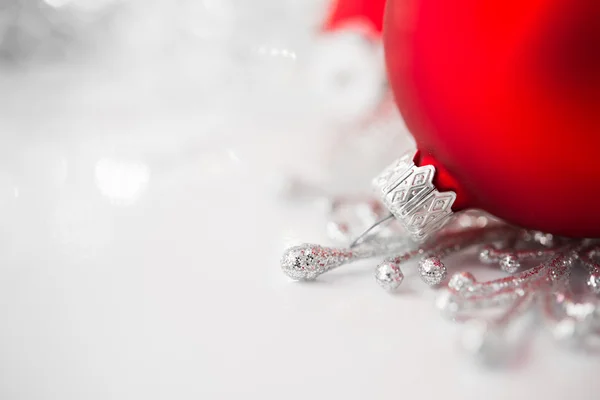 Red and silver xmas ornaments on bright holiday background. Merry christmas! — Stock Photo, Image