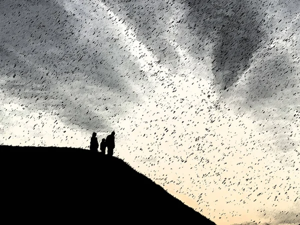 Silhouette of people on the top of the mountain. The family comes down the mountain. Silhouettes of people in the distance on the hill.