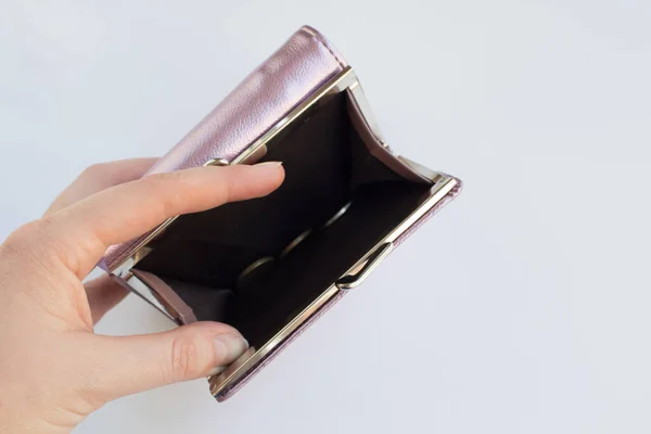 Empty wallet in a womans hand. Financial crisis concept. Unemployment, impoverishment, redundancies in enterprises Royalty Free Stock Images