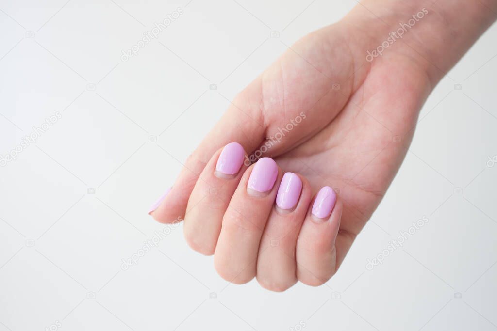 Regrown manicure. Female hand with regrown nails before correcting gel polish. Well-groomed hands. copy space trending. Place for text.