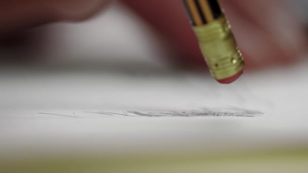 Close Man Hand Pencil Eraser Erases What Drawn Sheet Paper — Stock Video