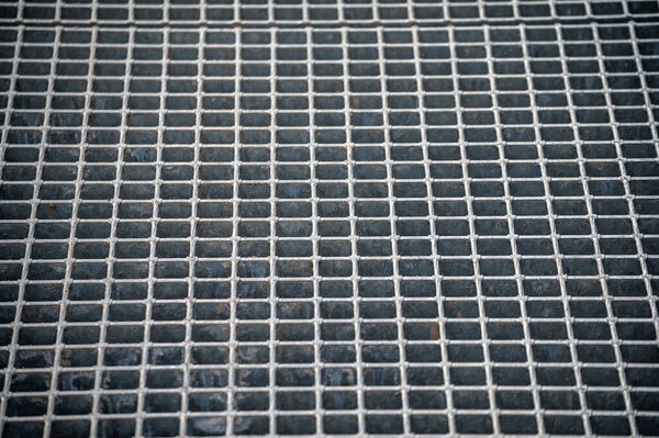 Metal ventilation grill of the subway. Industrial texture close up. Metal mesh texture. Abstract background.