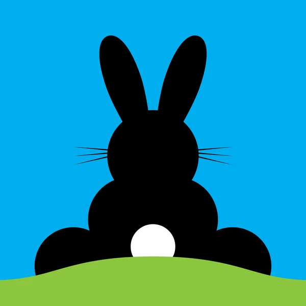 Vector sentado atrás conejito de Pascua — Vector de stock