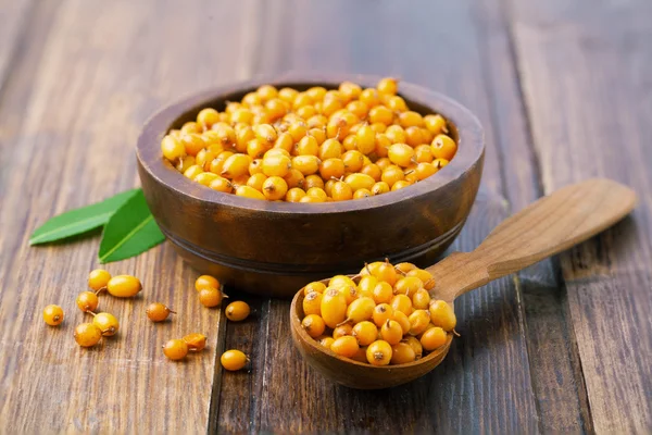 Sea buckthorn on a wooden — Stock Photo, Image