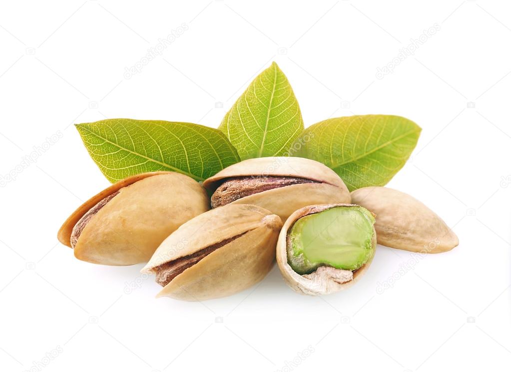 Pistachio nuts with leaves.
