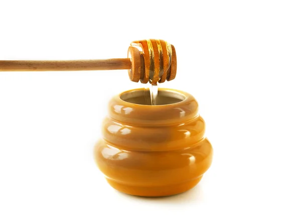 Jar of honey with drizzler. — Stock Photo, Image