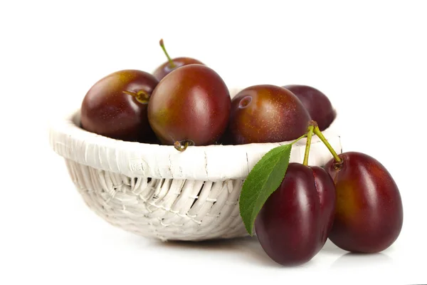 Plums in a basket — Stock Photo, Image