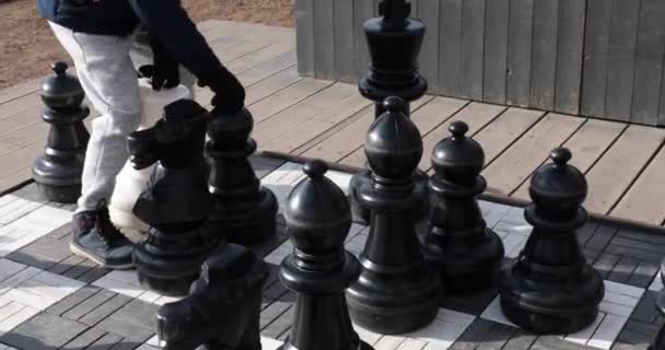 Giant chess on a large chessboard of the children playground — Stock Video