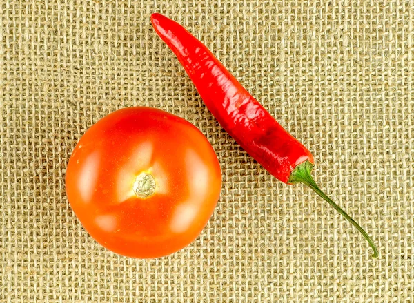 Fragrant tomato and raw chili pepper — Stock Photo, Image