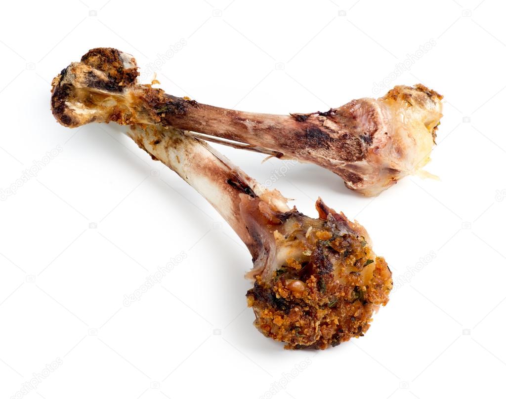 Closeup Of Cooked Chicken Bones Isolated Against White Stock Photo