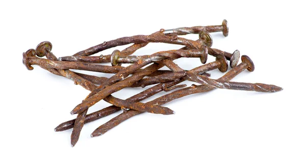 Macro of pile of rusty nails isolated against white — Stock Photo, Image