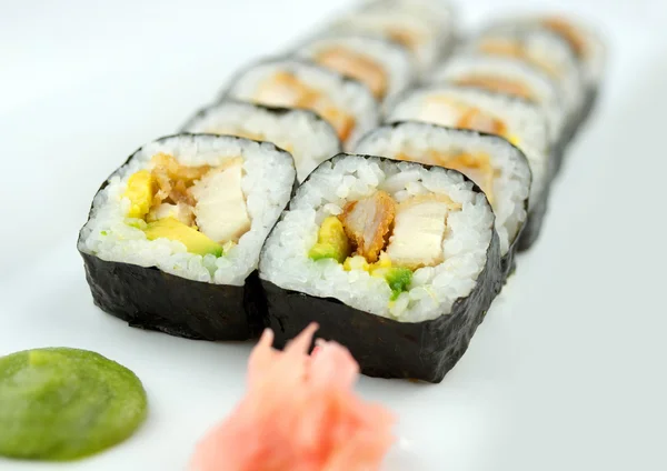 Macro of fried breaded chicken sushi rolls with wasabi and pickl — Stock Photo, Image