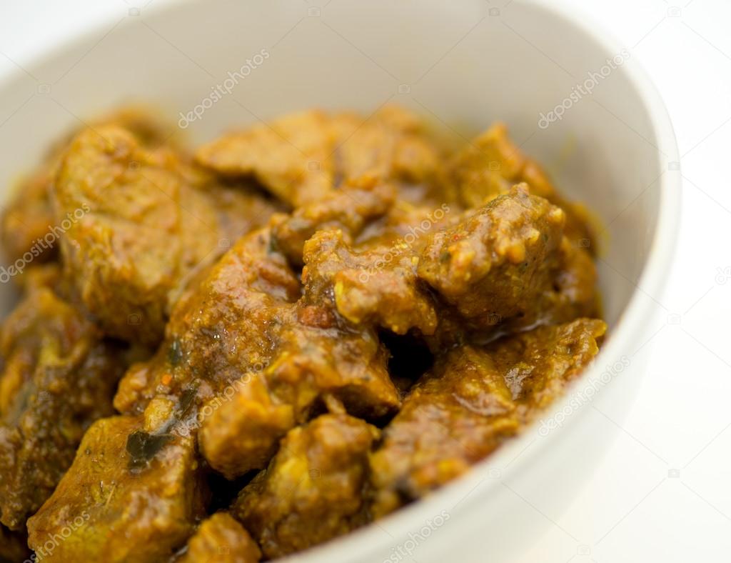 Spicy Indian goat lamb curry in bowl