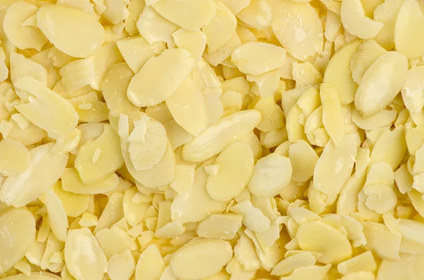 Background texture of almond flakes — Stock Photo, Image