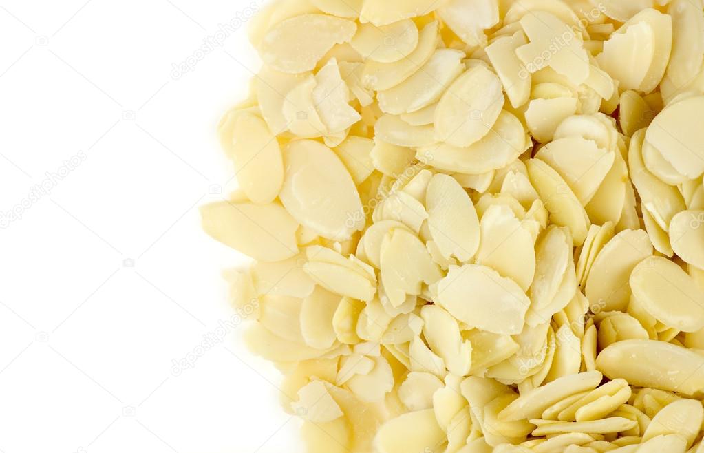 Aerial view of almond flakes with white copyspace