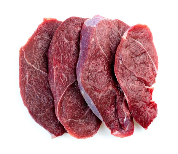 Butcher shot of beef steaks isolated in studio — Stock Photo, Image
