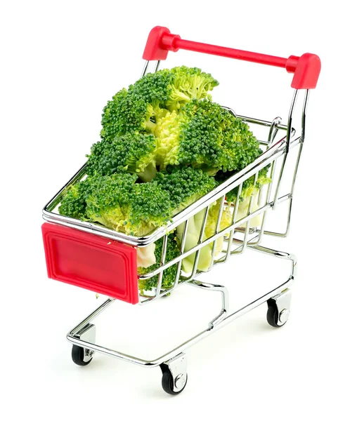 Mini shopping trolley stuffed with juicy green broccoli isolated — Stock Photo, Image