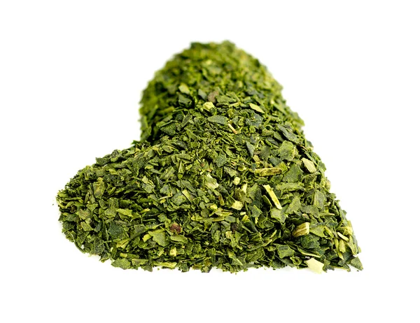 Healthy heart shaped dried green tea — Stock Photo, Image