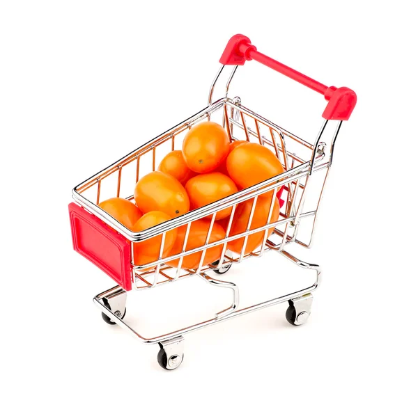 Orange gold grape tomatoes in mini shopping cart — Stock Photo, Image