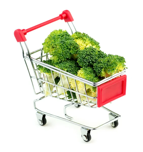 Giant broccoli bunches in market shopping store cart isolated on — Stock Photo, Image