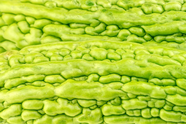 Macro fundo textura closeup de melões amargos verdes — Fotografia de Stock