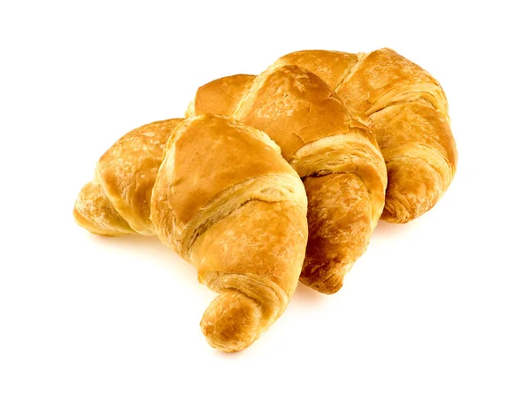 Grupp av läckra croissanter i studio på vit — Stockfoto