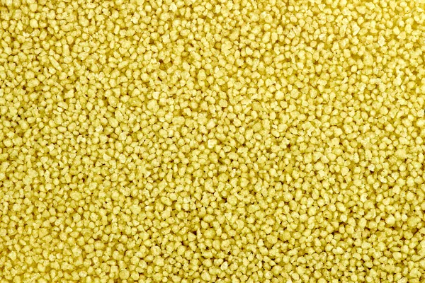 Macro background texture of raw uncooked couscous — Stock Photo, Image