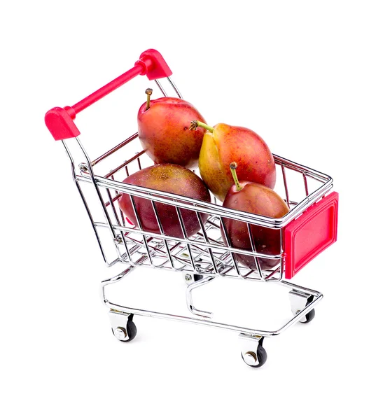 Gigantic sugar plums in shopping cart — Stock Photo, Image