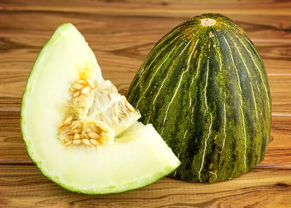 Rustik gourmet jul melon på trä bakgrund — Stockfoto